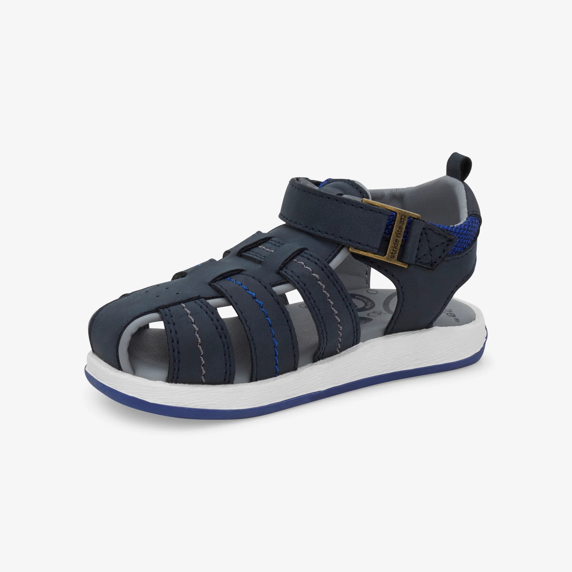 Angled view of the Stride Rite Paddy Sandal in navy, emphasizing its stylish yet functional design for active kids.